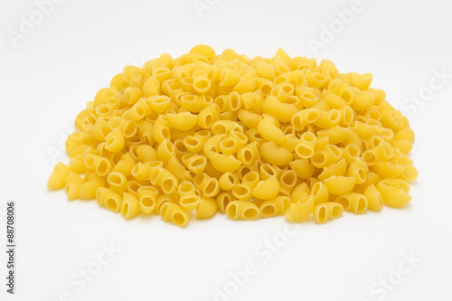 Raw macaroni on white background
