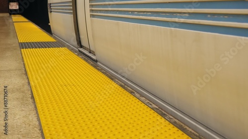 City Subway Train Stops At Platform and Passenger Boards