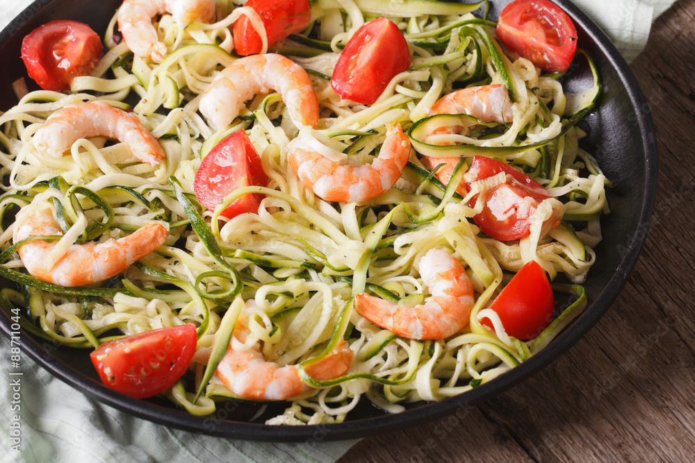 Dietary food: zucchini pasta with shrimp closeup. horizontal
Dietary food: zucchini pasta with shrimp closeup. horizontal