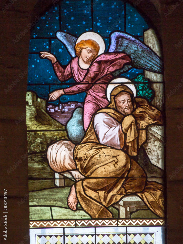 St. angel talking to. Joseph, stained glass window of the Church
