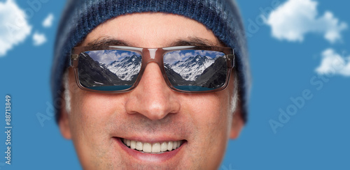 Close up of a man s face wearing sunglasses