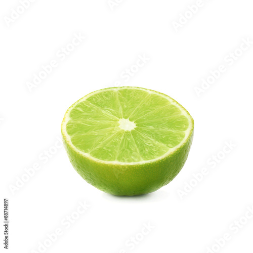 Ripe lime cut in half isolated over the white background