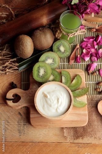 Yogurt white with green kiwi fruit and kiwi juice.