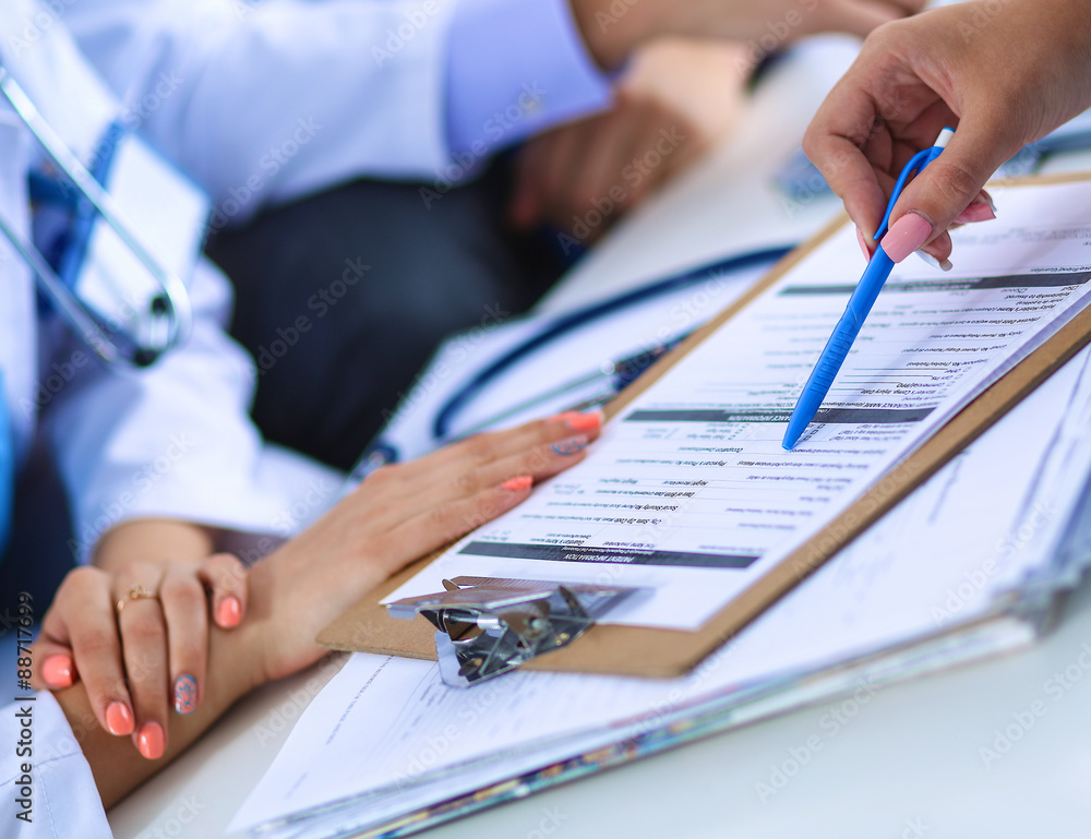 Happy medical team discussing and working together Happy medical team discussing and working together