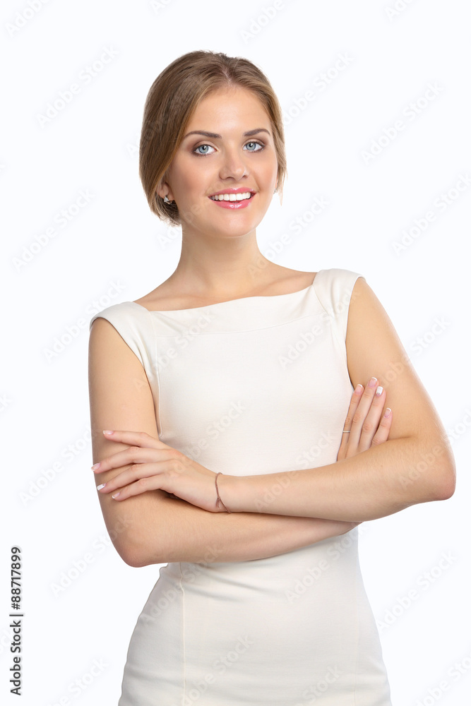 Portrait of an attractive young woman standing with crossed arms Portrait of an attractive young woman standing with crossed arms