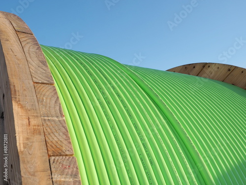 Green fiber optic cable on a timber drum used in the Australian National Broadband Network fiber to the Home Roll-out, Melbourne, Australia 2015
