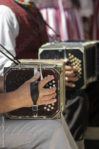 Mans playing the bandoneon photo