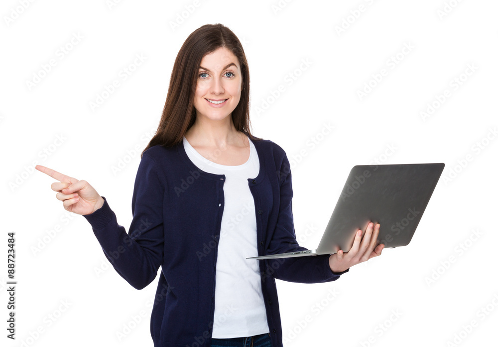 Woman use of the notebook computer and finger point aside Woman use of the notebook computer and finger point aside