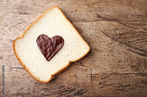 slice of bread with chocolate sauce in heart shape