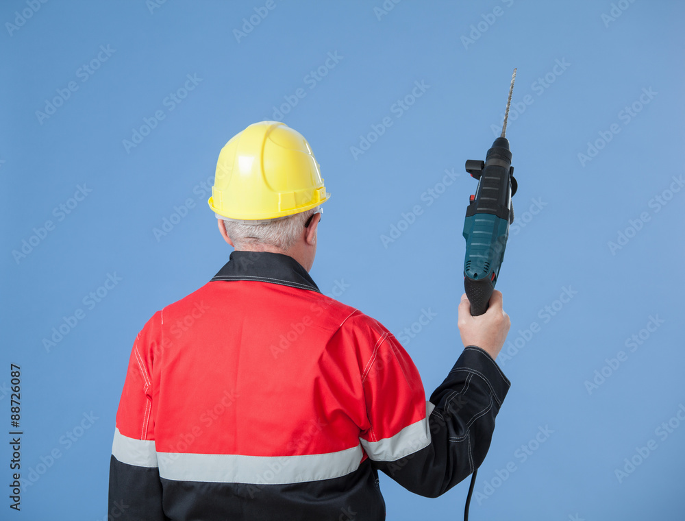Builder holding a drill Builder holding a drill