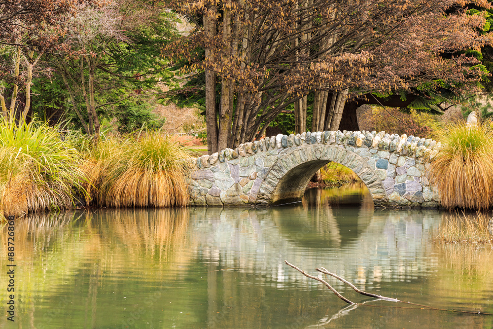 Naklejka premium stone bridge in garden