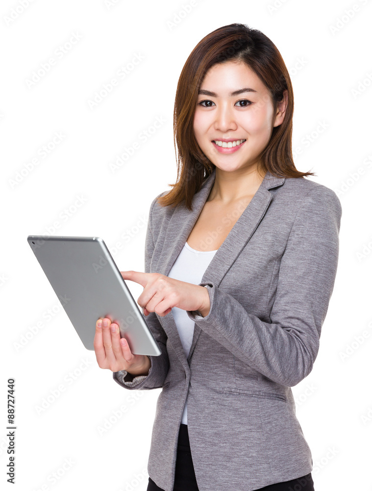 Asian businesswoman use of the tablet pc Asian businesswoman use of the tablet pc