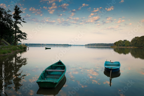 Fototapeta Naklejka Na Ścianę i Meble -  Rowing boats floating over the Lake Elk waters. Masuria, Poland.