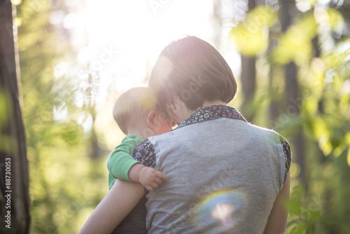 Billede på lærred Young mother enjoying a beautiful moment of love, tenderness and
