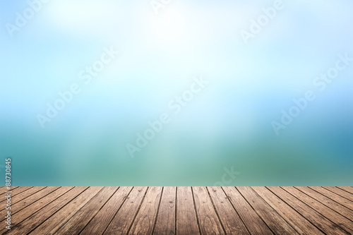 wooden floor with sky blurred background
