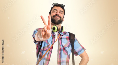 Tourist doing victory gesture