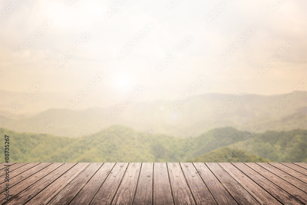 wooden floor with mountain landscape blurred background