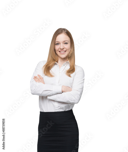 Smiling young business lady with crossed hands is thinking about something. Isolated.