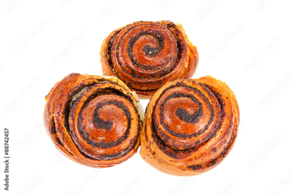 Fototapeta premium three tasty rolls buns with poppy seeds on a white background