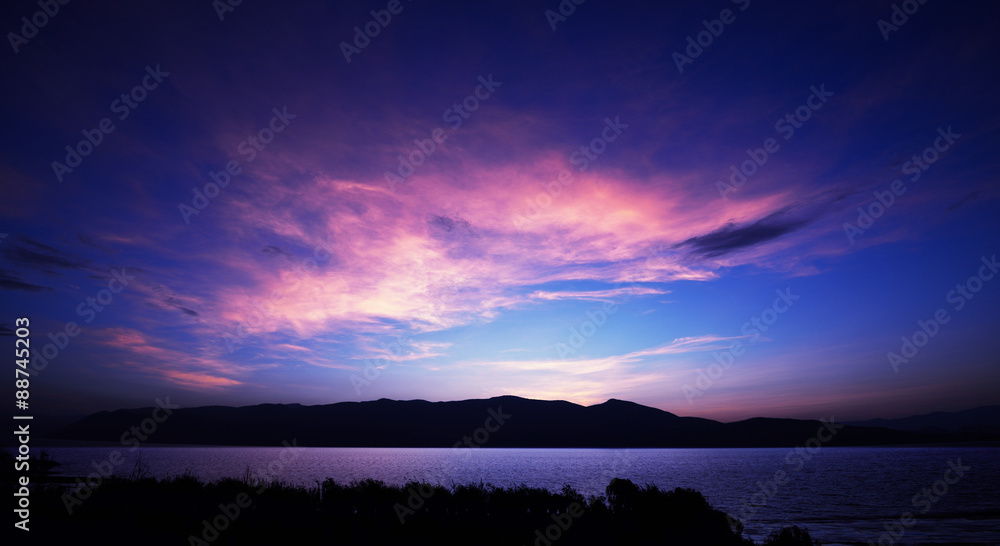Fototapeta premium the lake ripples in rosy dawn