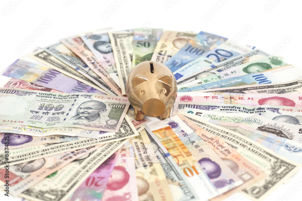 Fototapeta premium Golden piggy bank with International currencies