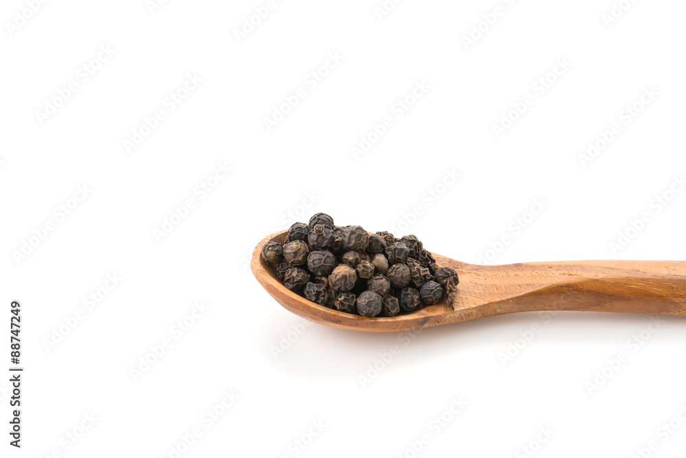 Black pepper with wood spoon