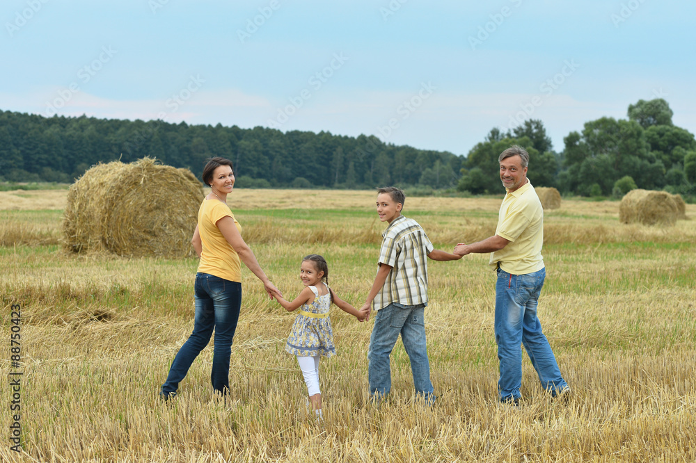 Happy family in wheat field Happy family in wheat field