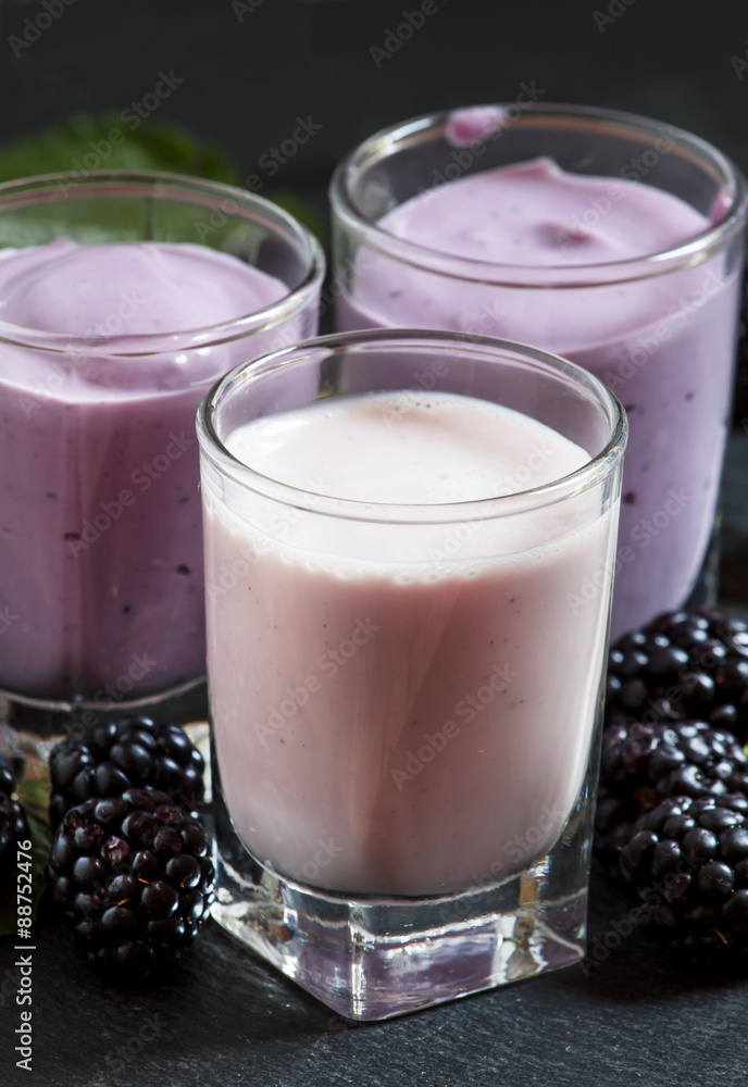 Homemade yogurt and milk cocktail with berry blackberries, selec Homemade yogurt and milk cocktail with berry blackberries, selec