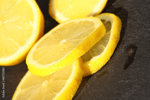 Lemon sliced slate.
Slices of lemon on a slate background.
