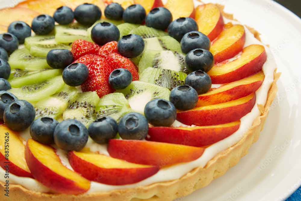 Fresh Fruits on Top of Tasty Cake with Frosting Fresh Fruits on Top of Tasty Cake with Frosting