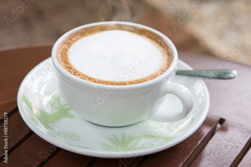 cup of coffee on wooden