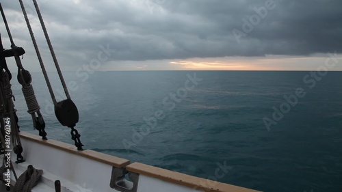 Sunrise at Mediterranean sea from ancient  sailboat deck
