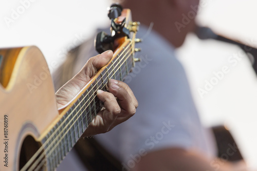 playing guitar on stage