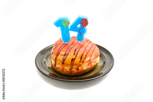 donut with fourteen years birthday candle