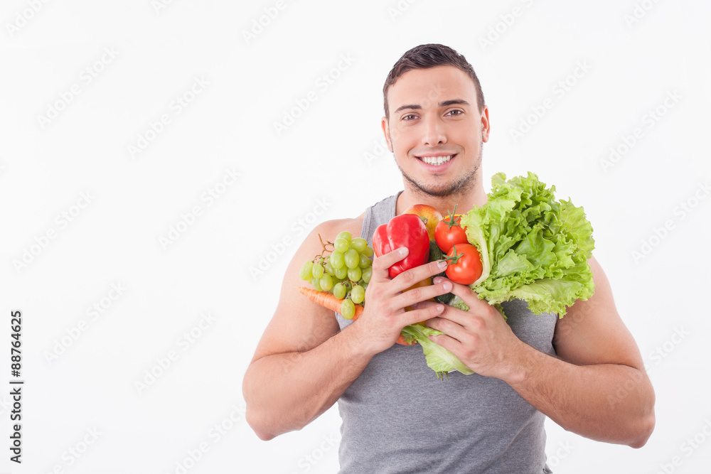 Handsome fit young man likes healthy eating