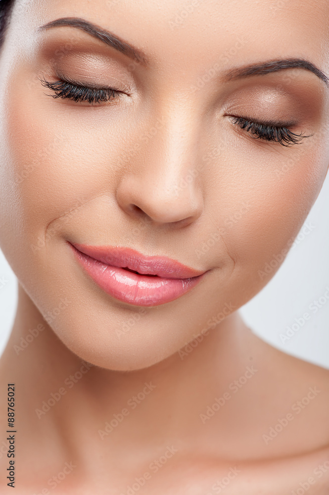Cheerful young girl is caring of her skin Cheerful young girl is caring of her skin