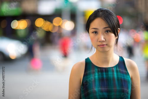 Young Asian woman serious face portrait