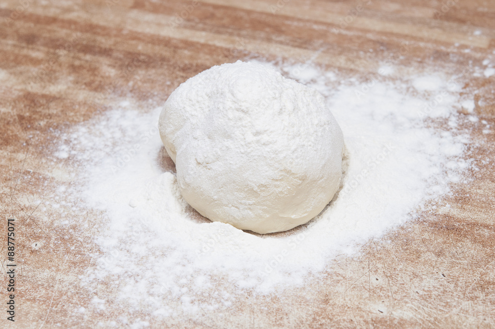 Sprinkle flour on dough Sprinkle flour on dough