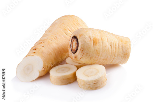 Obraz na plátně Fresh parsnip roots on a white background