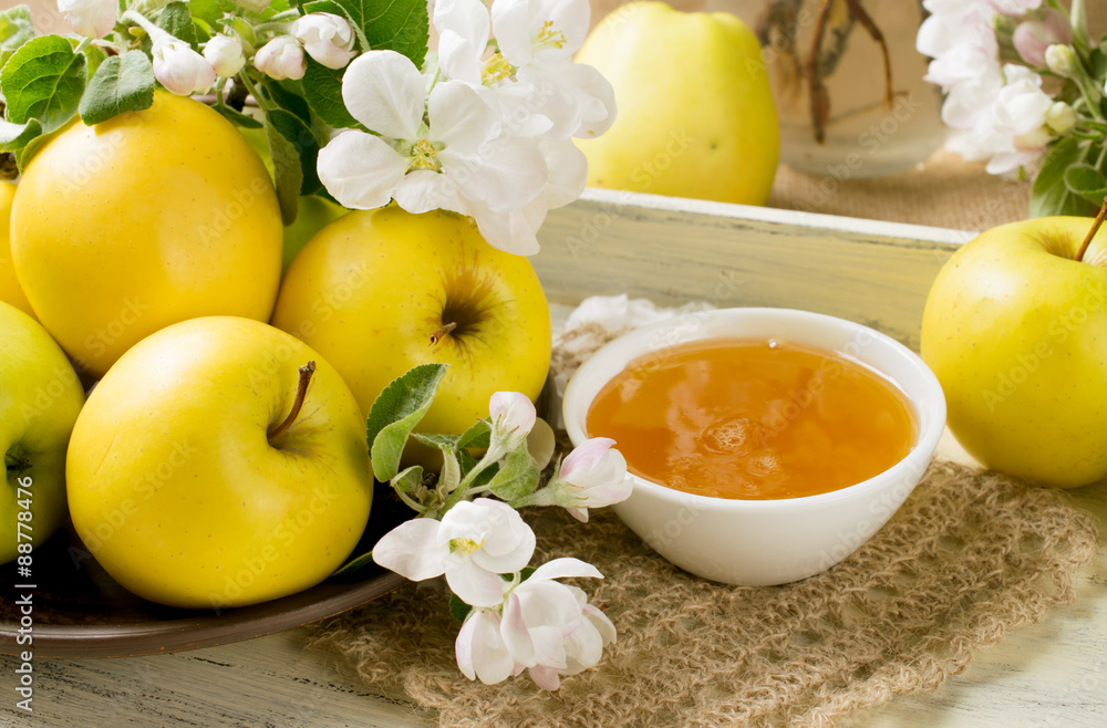 Still life with apples, twig of apple tree and honey on the tray Still life with apples, twig of apple tree and honey on the tray