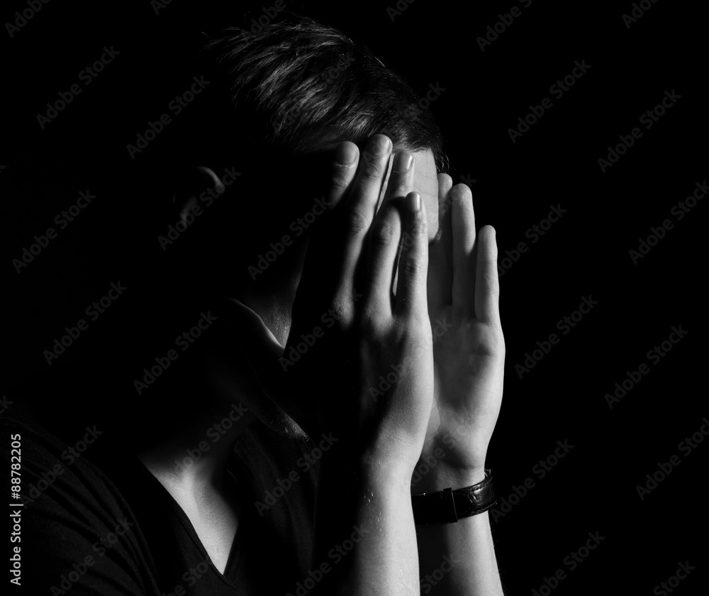 Man hidden face. Cry or grief feelings