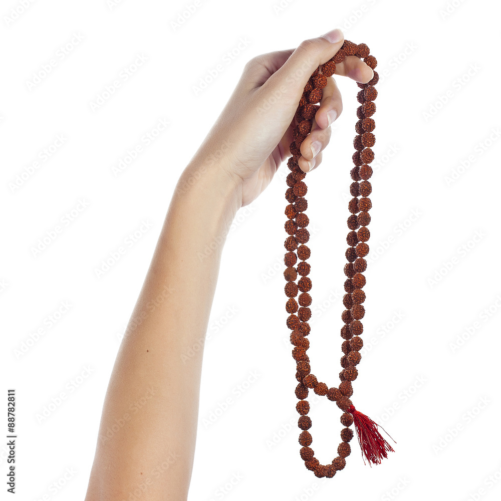 Rudraksha rosary in a female hand. Japa mala. Stock Photo