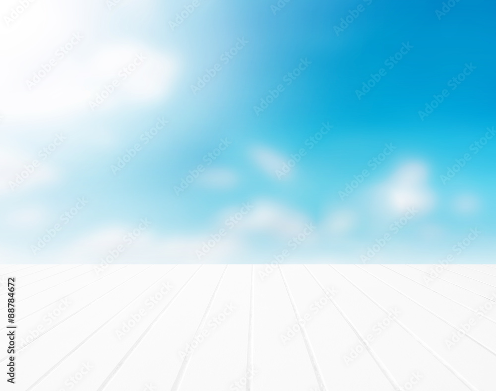 White wood floor with blurred clouds sky background