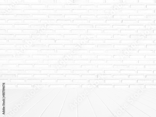 interior of white brick wall with white wooden floor.