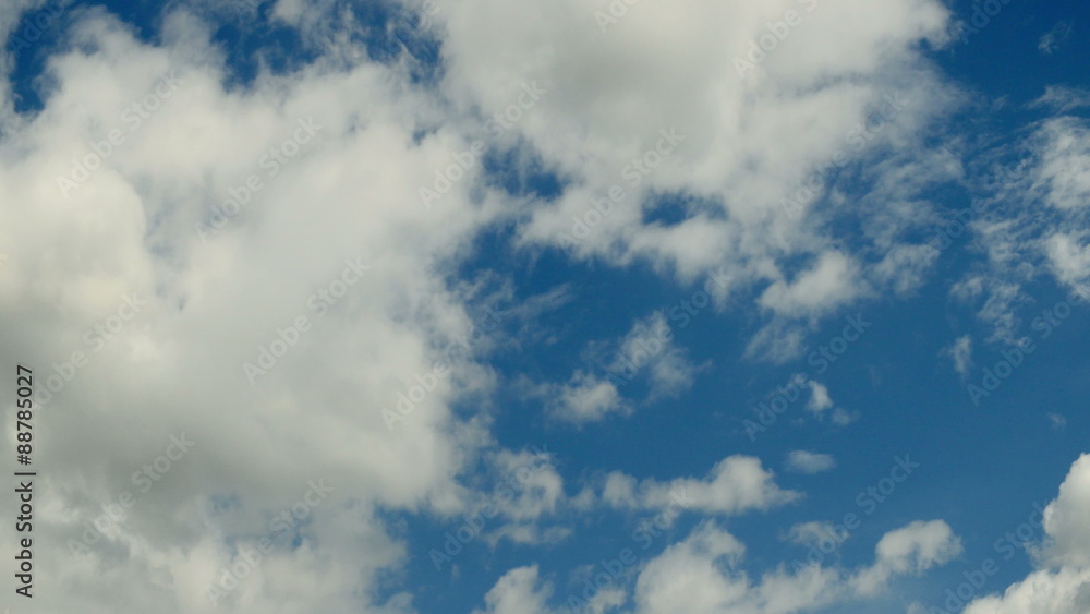 White clouds flying on blue sky, time lapse.
White clouds flying on blue sky, time lapse.