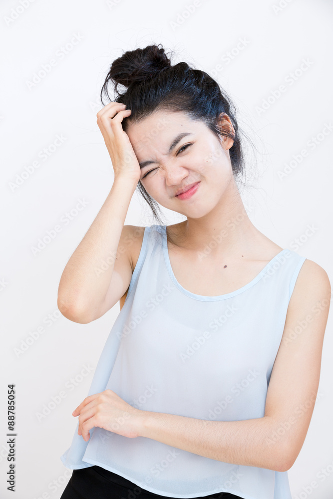 Young asian student suffering from a headache Young asian student suffering from a headache