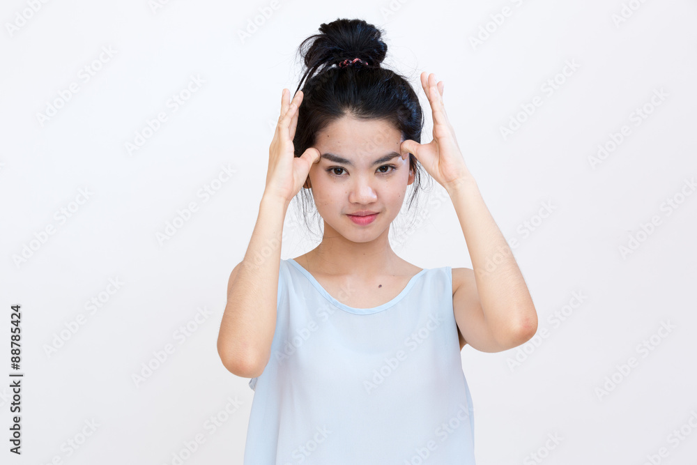 Young asian student suffering from a headache Young asian student suffering from a headache
