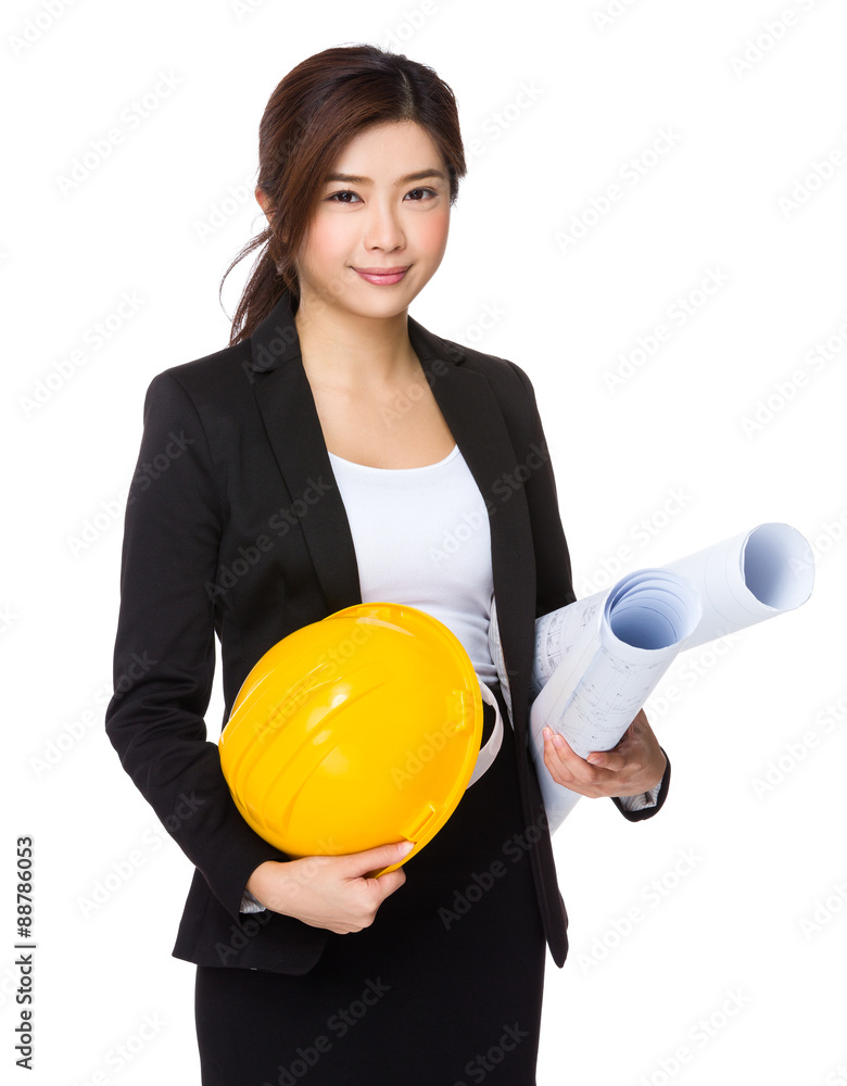 Asian Young enginner with yellow helmet and blue print Asian Young enginner with yellow helmet and blue print