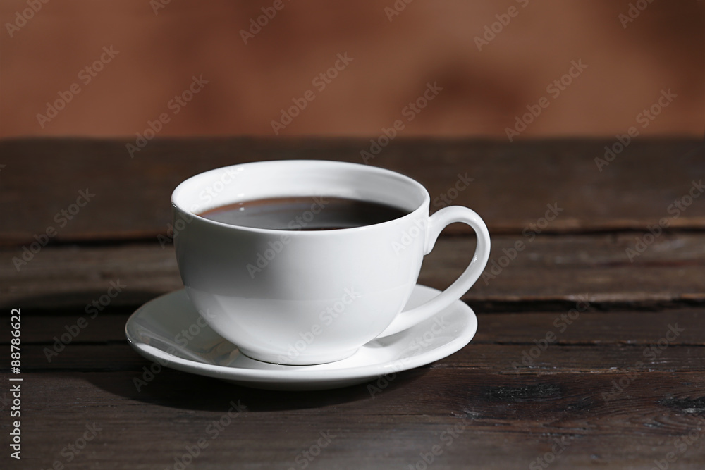 Fototapeta premium Cup of coffee on blurred background