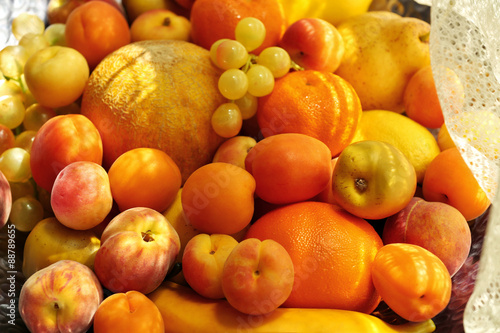Fototapeta Naklejka Na Ścianę i Meble -  Heap of fresh fruits on tray close up